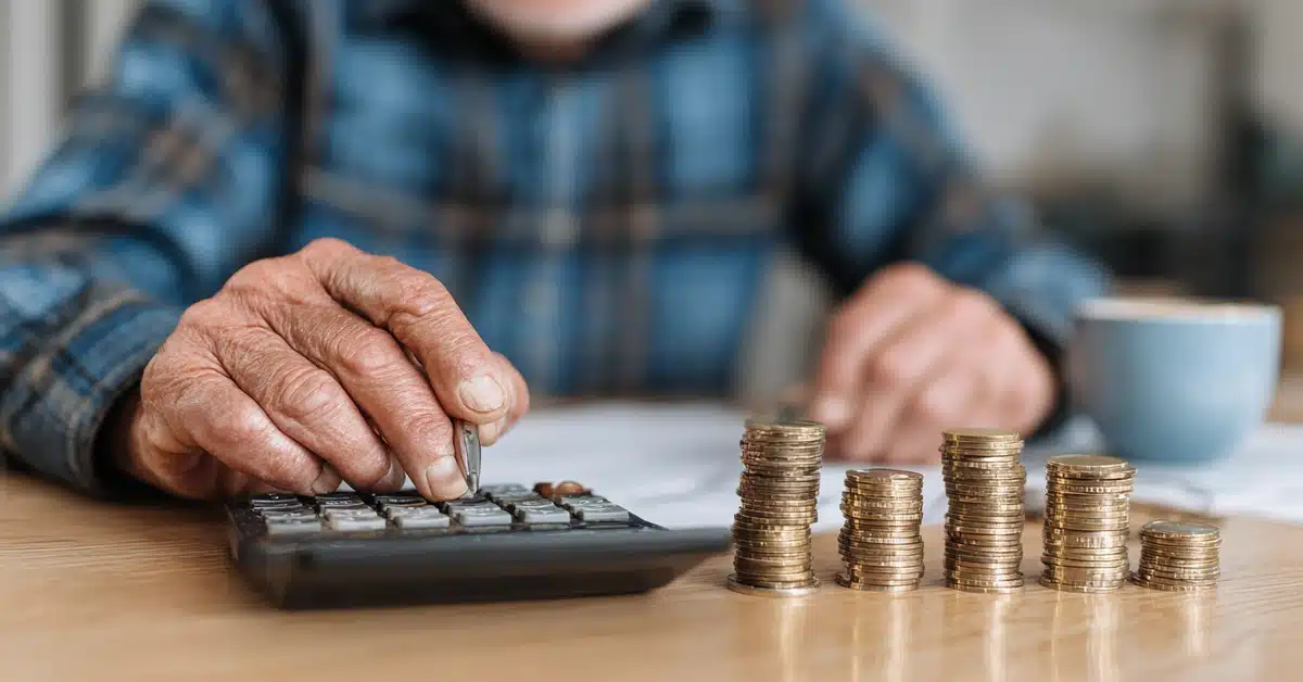 Person using a Bi-Weekly Mortgage Payment Calculator to estimate savings